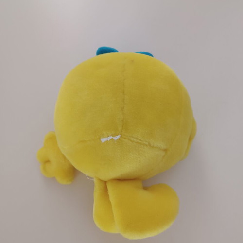 Yellow plush smiley with blue bow