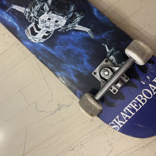 Skateboard used with satellite design on bottom