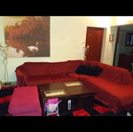 Large corner sofa with pouf like new