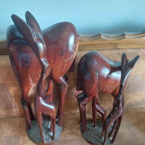 African woodcarvings used, two large gazelle sculptures, mahogany