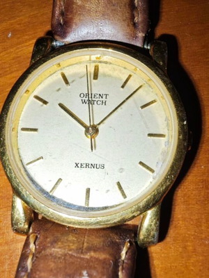 Orient Xernus wristwatch used with brown leather strap
