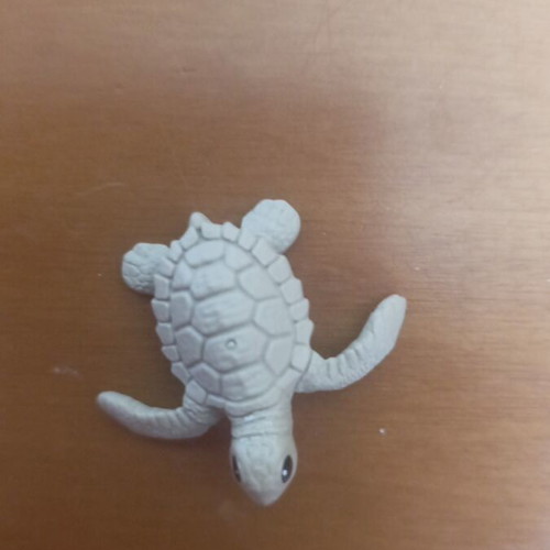 Small plastic turtle like new, light green color