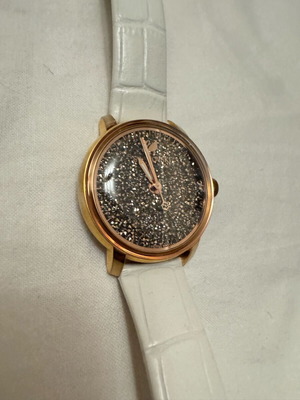 Swarovski watch used with white strap and black glitter detail
