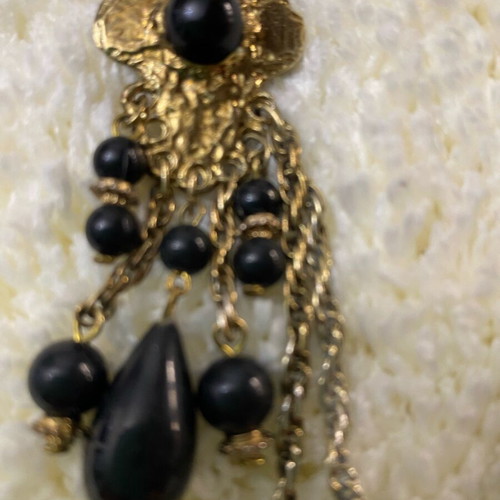 Vintage double brooch like new, gold color with black stones