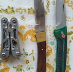 Multitool with two pocket knives used