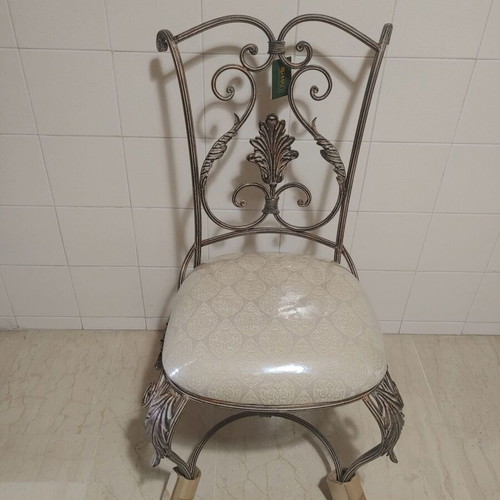 Set of 2 wrought iron dining chairs with decorative leaf details
