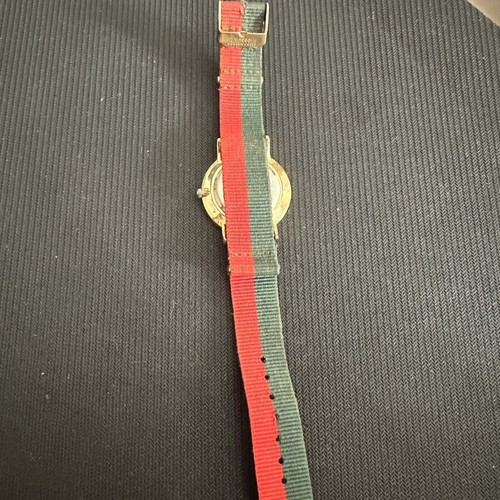 Fashion watch with gold case and NATO fabric strap