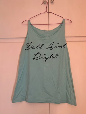 Blue sleeveless blouse with design