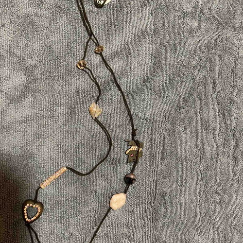 Necklace with brown leather cord and pink beads used