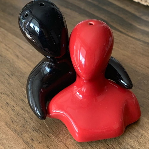 Salt and pepper shakers hugging pair like new