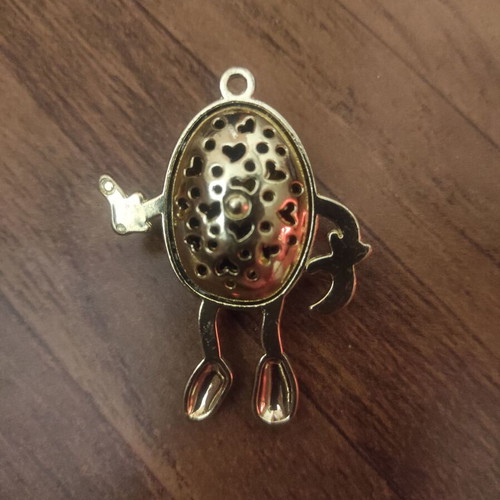The Smiling Child pendant necklace like new, gold with white enamel