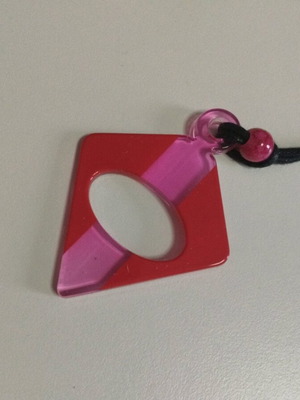 Necklace like new, plastic pendant with cord