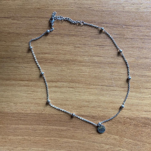 Steel necklace with letter alpha like new