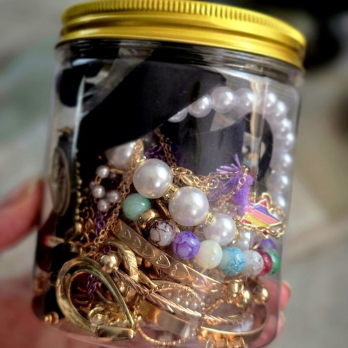 Jar with jewelry, necklaces, rings, bracelets and earrings