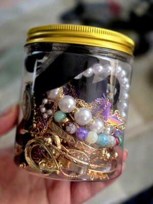 Jar with jewelry, necklaces, rings, bracelets and earrings