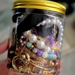 Jar with jewelry, necklaces, rings, bracelets and earrings