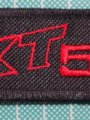 Fabric keychain XT 550 new, black, embroidered logo