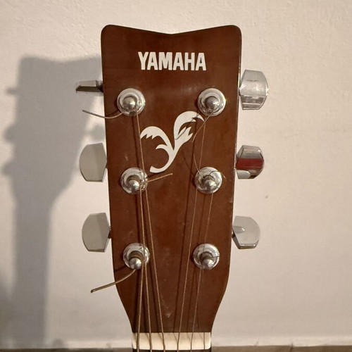 Yamaha F310 acoustic guitar like new with original case and Hercules stand