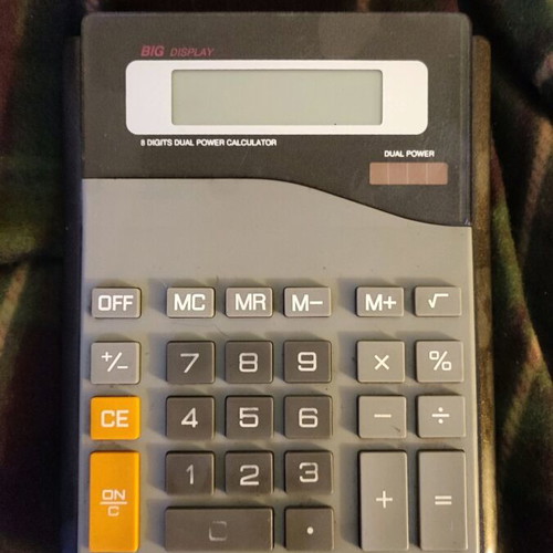 Large calculator used, size 20x15.5 cm