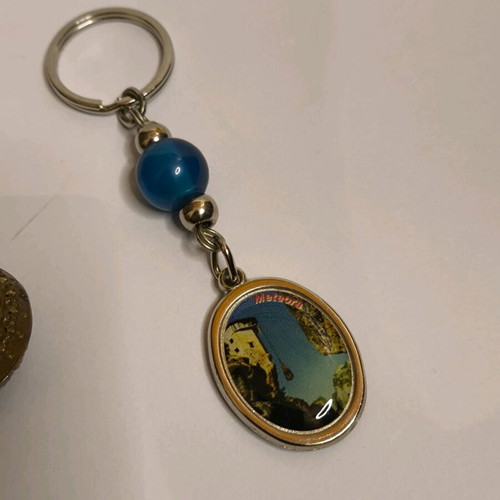 Set of 3 keychains like new with Meteora, evil eye and religious images
