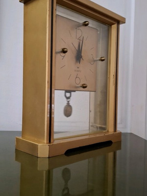 Vintage quartz table clock with pendulum used