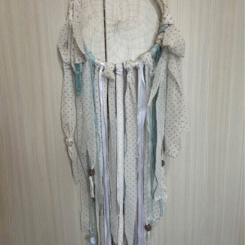 Decorative handmade dreamcatcher in white and blue shades for baby room