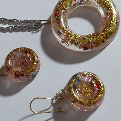 Two sets of handmade pendants and earrings, multicolor