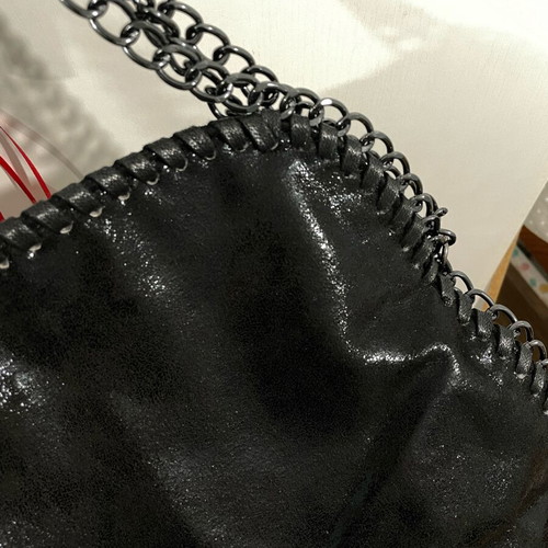 Women's shoulder bag black, new, with chains and zipper