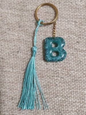 Handmade keychain with resin letter B, stones and tassel