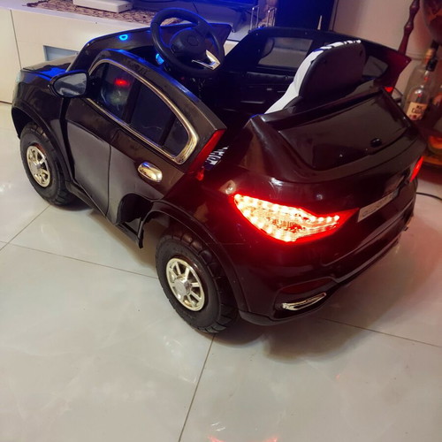 BMW X6 electric ride-on car like new with remote control and LED lights