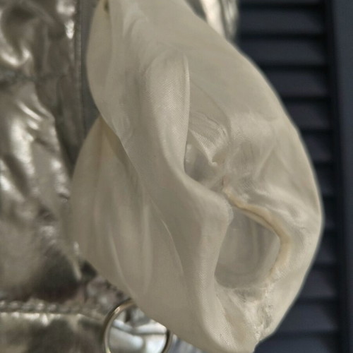 Silver sleeveless jacket used for girls aged 9-11 years