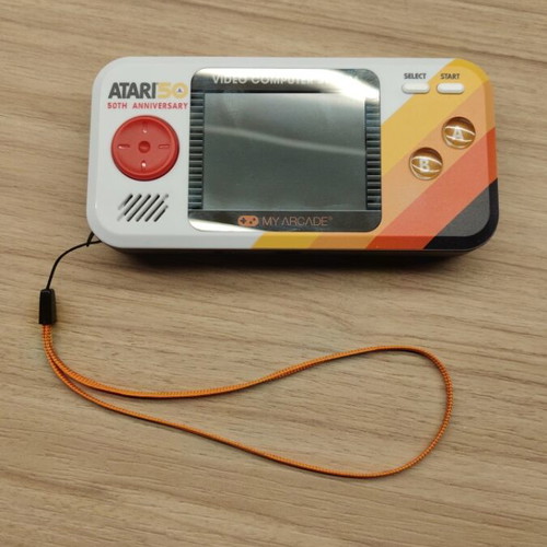 Atari Pocket Player Pro handheld console with games and box