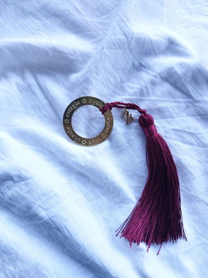 Handmade charm with metal elements and tassel