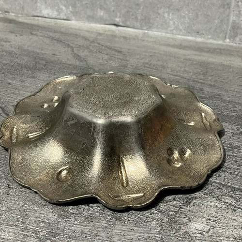 Decorative metal bowl used with embossed design