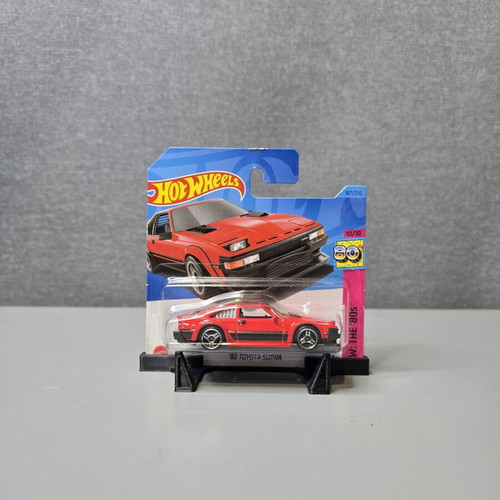 Hot Wheels 82 Toyota Supra toy car with slight hook wear