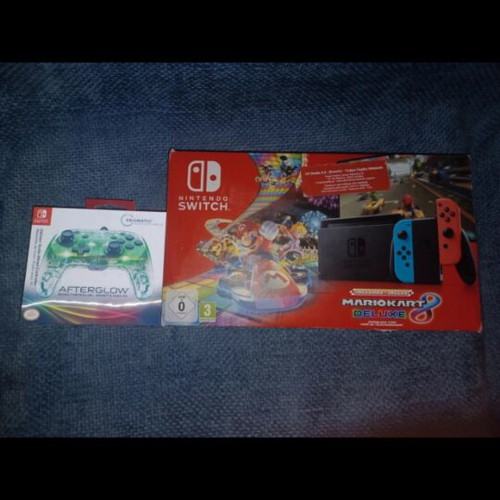 Nintendo Switch console with controller, Mario Kart Deluxe 8 code