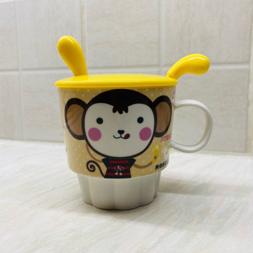 Ceramic mug new with plastic lid and spoon