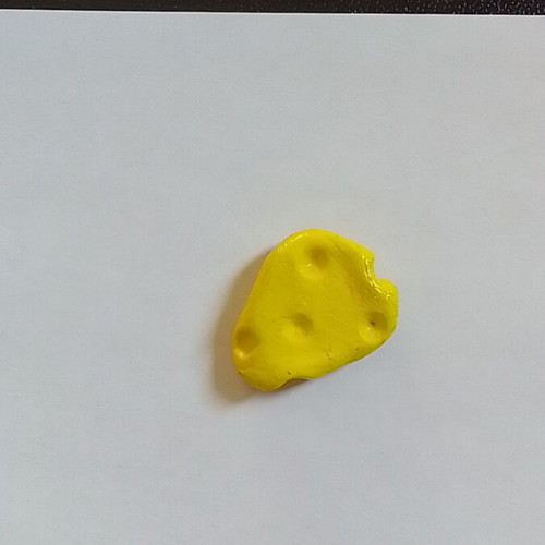 Handmade cheese magnet from clay