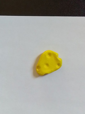 Handmade cheese magnet from clay