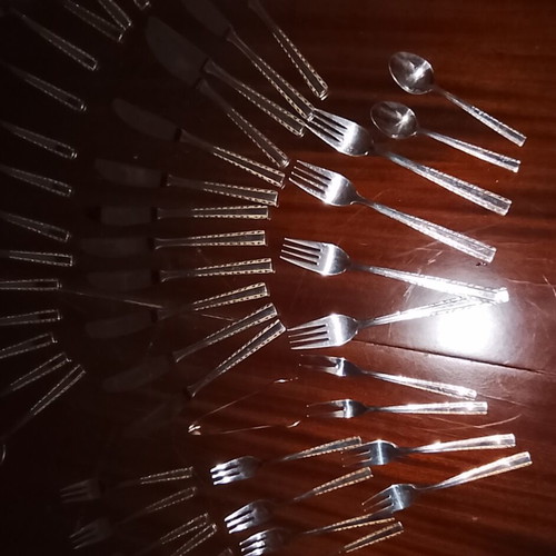Solingen cutlery set incomplete with gold border on handles, used