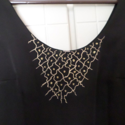 Black dress with gold design size M like new
