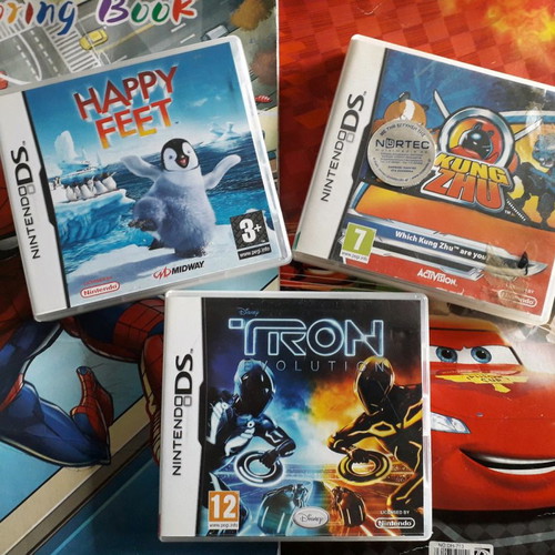 DS boxed games used, pack with Happy Feet, Kung Zhu, Tron Evolution