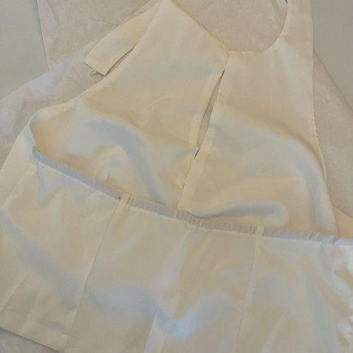 White sleeveless top with bows size S like new