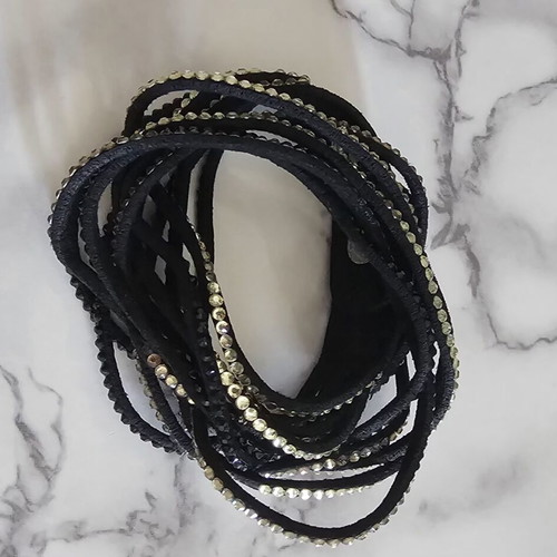 Black suede bracelet with black and beige stones