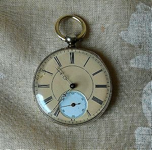 Ασημένιο ρολόι τσέπης, αρχές 20ου αιώνα. Κουρδίζει με κλειδί. T:M 10982. Καντράν πορσελάνης. Διάμετρος 42 χιλιοστά. Έγινε σέρβις. Λειτουργικό.