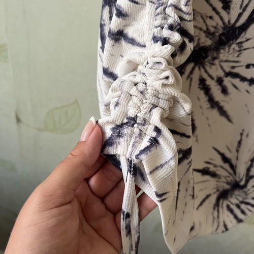 White elastic dress with unique design and side ties, like new, sizes S/M