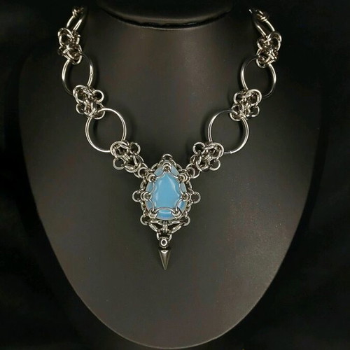 Handmade necklace made of steel and stone like new, silver color