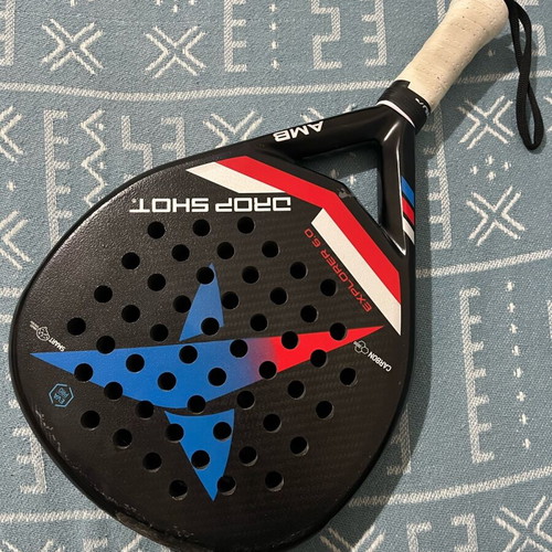 Padel racket Drop Shot used with signs of wear
