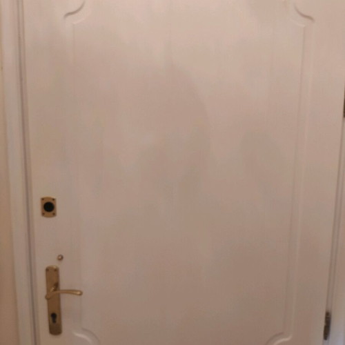 Lacquered entrance door used, terracotta exterior, white interior