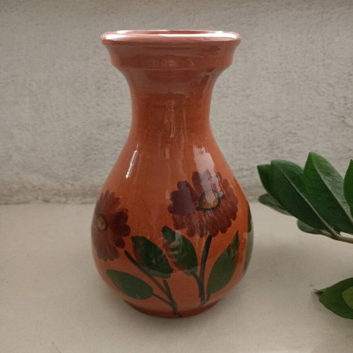 Traditional clay vase used, hand-painted with flowers